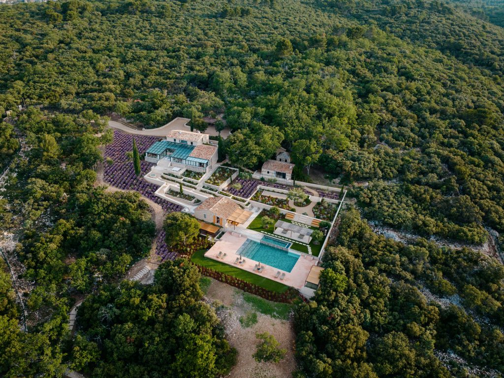 Spring in Provence: Villa Les Hauts de Gordes surrounded by blooming lavender and olive groves in the hills above Gordes.