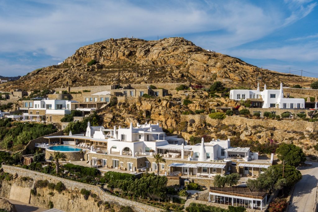 Villa Breeze in Mykonos Travel Guide with sea views, pool, wooden sauna, and tropical promenade near Mykonos Town.
