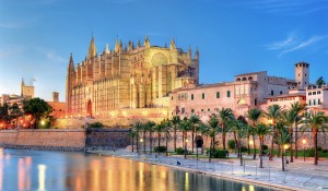 Cathedral of Palma de Majorca reflecting on the water at evening
