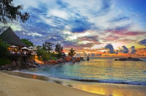 Cafe on tropical beach at sunset. Nightlife Mustique