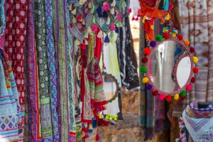 Mirror, handkerchiefs, scarves and handmade fabrics and beautiful bright colors, sold in a Ibiza Hippy Markets