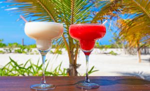 Two cocktails on luxury tropical sand beach. Caribbean Cocktails