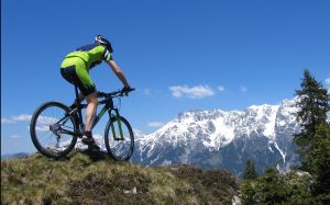 Mountain biker riding through the mountains. Val D’Isere Summer