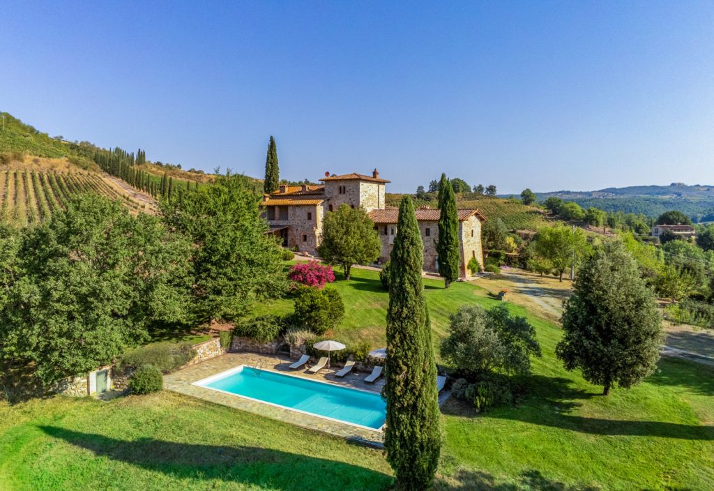 Villa Cipresso with a private pool surrounded by a stone terrace.