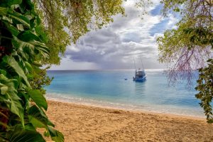 Beach view with a boat. 3 Fun and Favorite Things to Do on Barbados