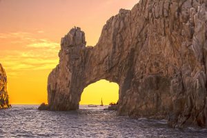 a picture of los cabos arch in a yellow sunset, water color, blue, yellow, horizontal, location, daylight, nature. Things to do in Cabo San Lucas