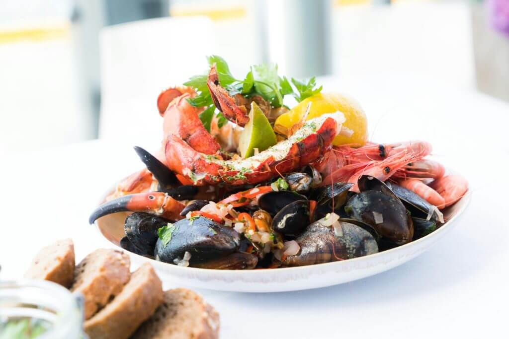 Fine dining experience at Eden Roc Cap Cana with gourmet presentation and luxurious ambiance