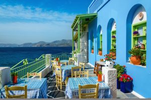 Typical colorful Greek restaurant in Greece.