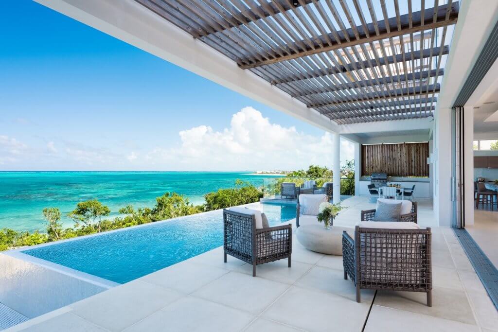 BE North 5BR Beachfront Villa terrace with infinity pool and panoramic Caribbean Sea views