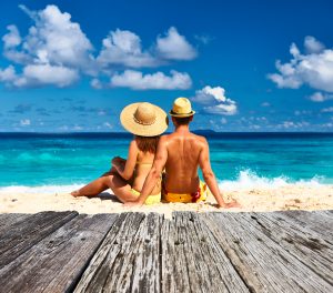 Couple on a tropical beach at Seychelles, La Digue. Affordable honeymoon destinations
