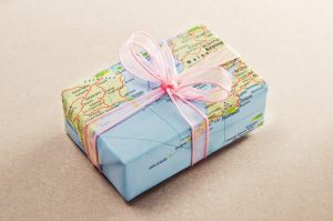 Gift with world map wrapping paper. travel gifts