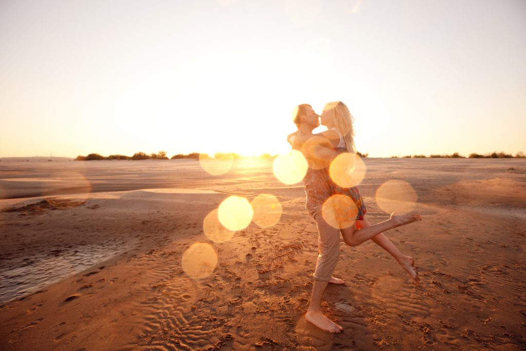 happy couple on the beach. Romantic getaways