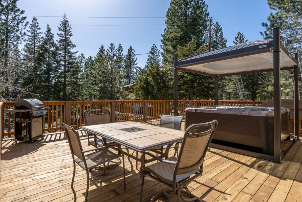 Cozy Cabin North Lake Tahoe deck with private hot tub and outdoor dining