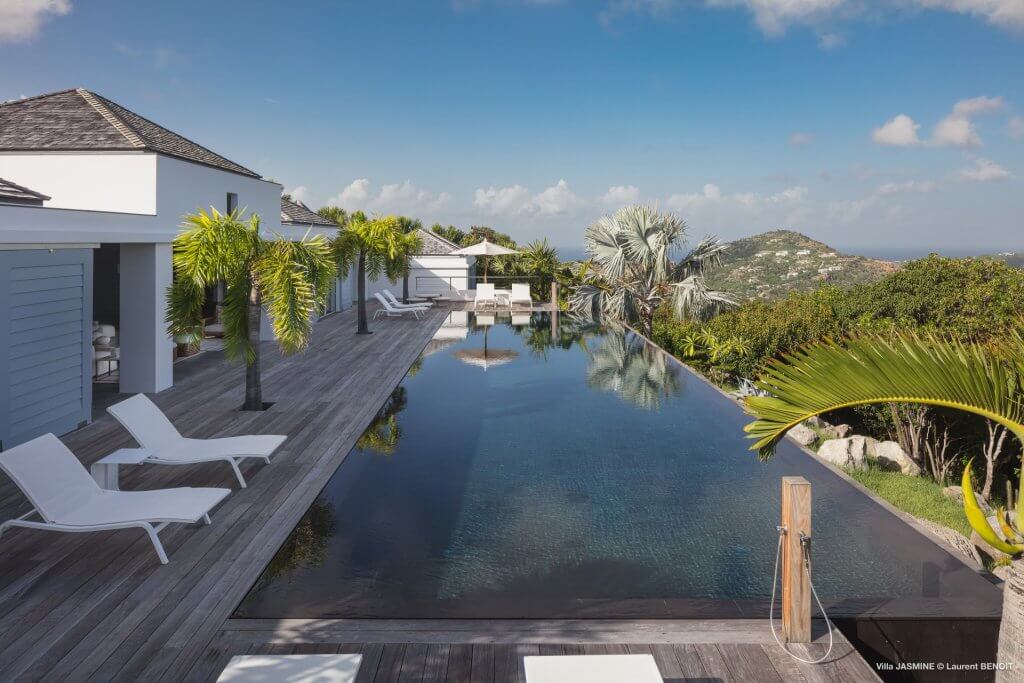 St Barts Vacation Rentals: Villa Jasmine St Barts vacation rentals: Jasmine (JAS) infinity pool with sun loungers, palms and sweeping hillside views
