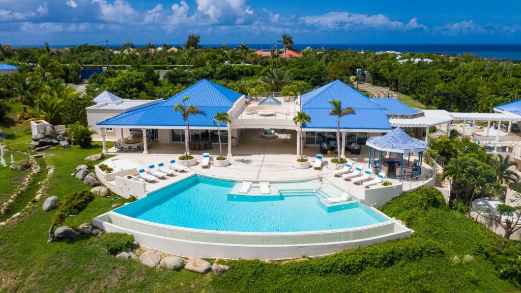 Cliffside Retreat in St Martin, featuring the main villa with an infinity-edge heated pool.