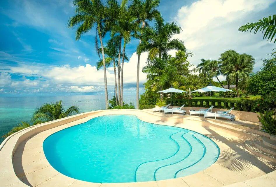 Rio Chico villa near Destiny Music Festival, private luxury with pool, sea views, and palm-filled gardens in Jamaica.