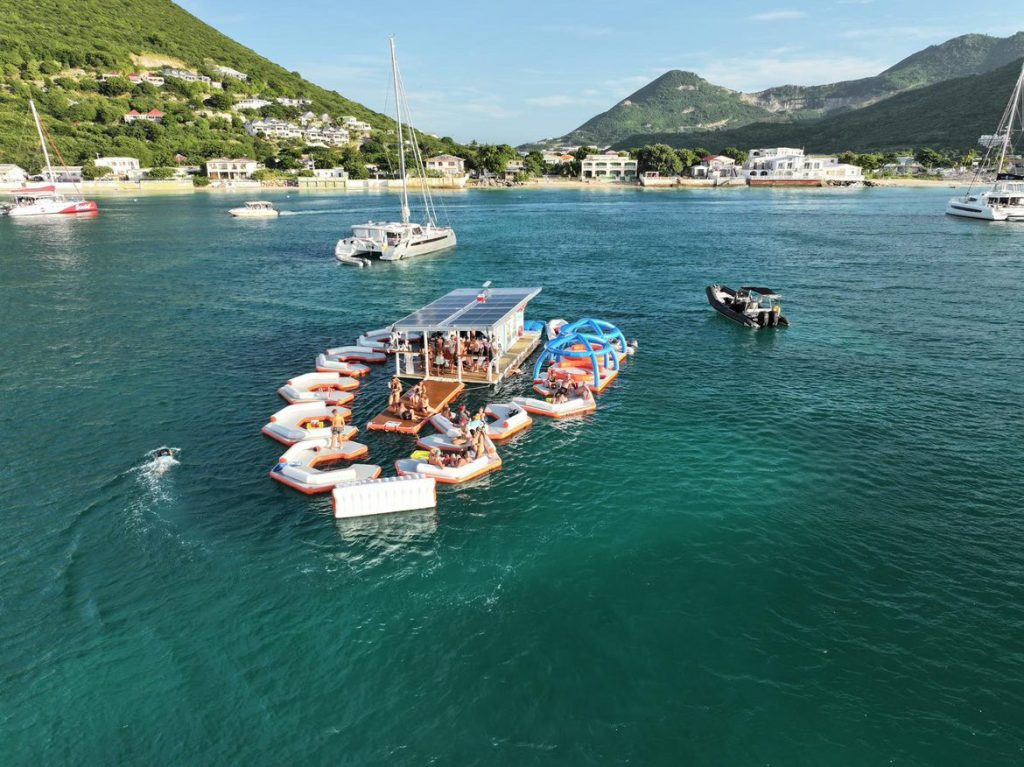 Floating restaurant on the sea in St Martin, offering unique St Martin Luxury Travel Experiences by Balaou.