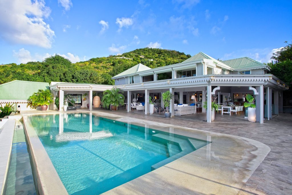 Villa Privilege offers refined St Martin Luxury Travel Experiences with a private pool, open-air living, and lush hillside views.