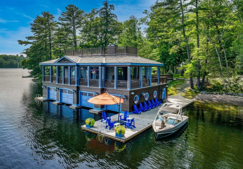 Star Acre villa on a serene Canadian lake, ideal for a luxury coolcation with dockside seating, boat access, and forest views