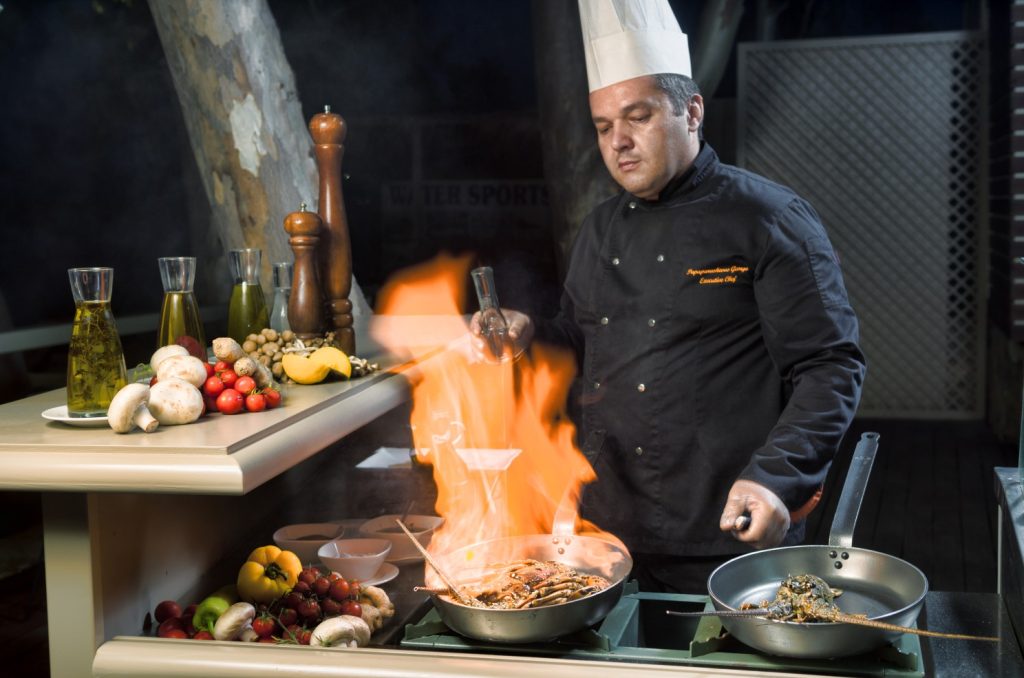 Private chef in St Barts preparing a gourmet meal, perfect for a smooth luxury vacation with kids and personalized family dining.