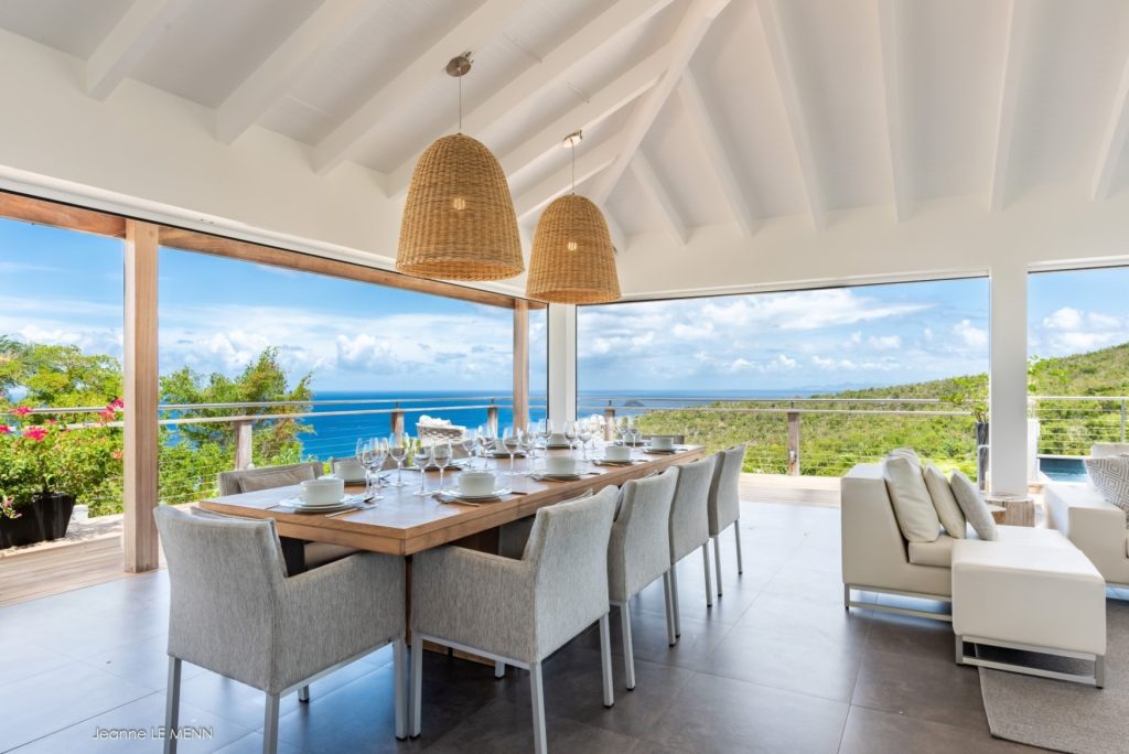 Elegant ocean-view dining setup in a luxury St Barts villa, styled for fine meals and curated culinary experiences.