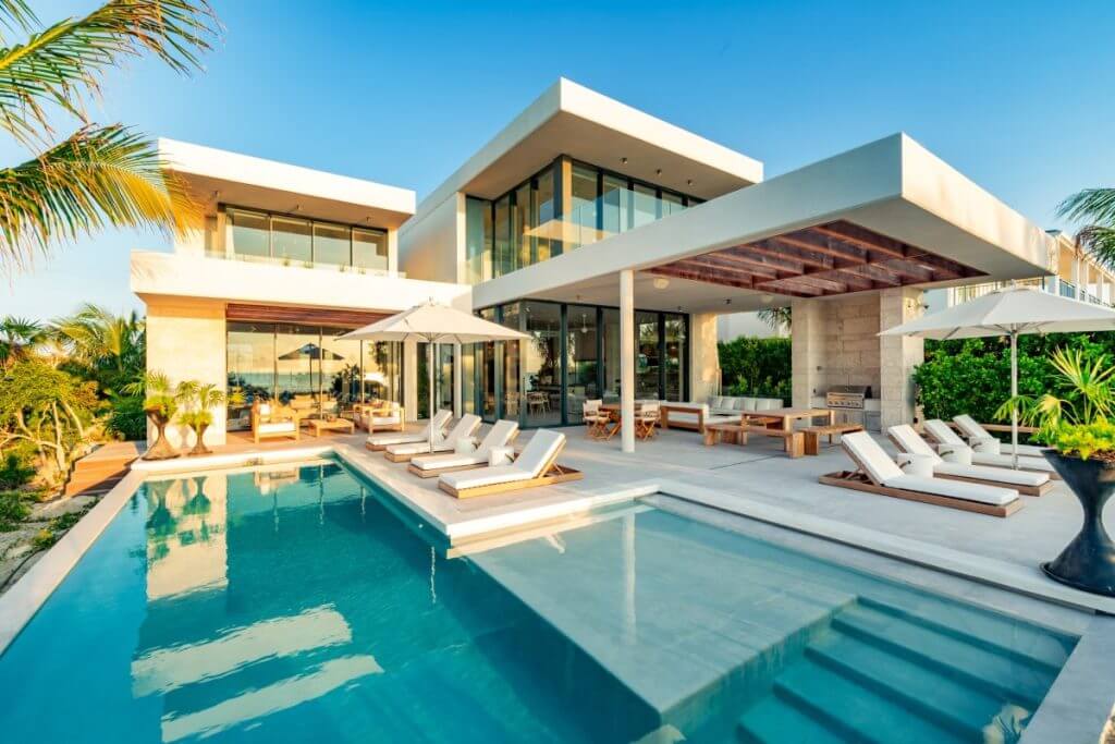 Top 10 TCI Villa Dune House with modern design, sun loungers, and private pool