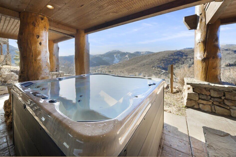 Hot tub with mountain views at Timber Lodge at the Oaks.