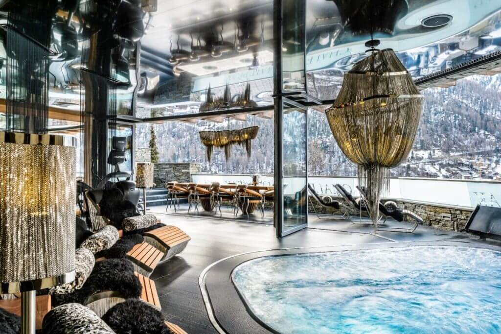 Chalet Zermatt Peak with snow-covered terraces and panoramic mountain views offering luxury concierge services