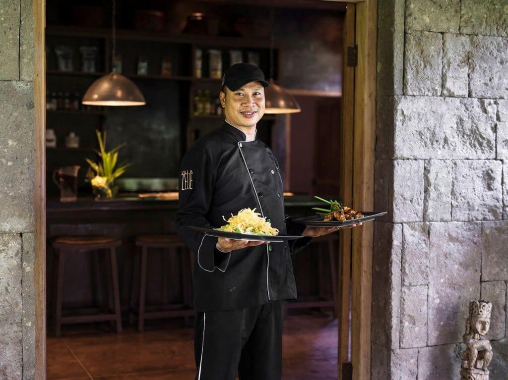 Private chef at Villa Zelie in Bali serving curated dishes, showcasing luxury experiences near Canggu Beach