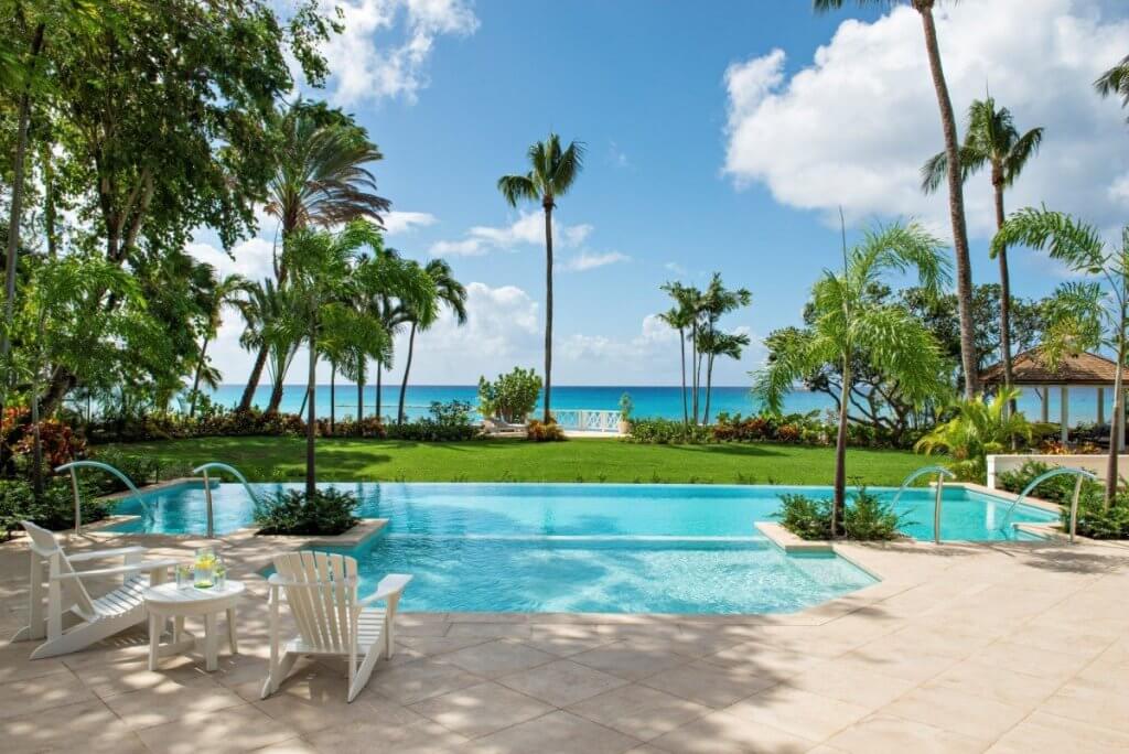 The Great House in Barbados with infinity-edge pool, garden, and ocean views.