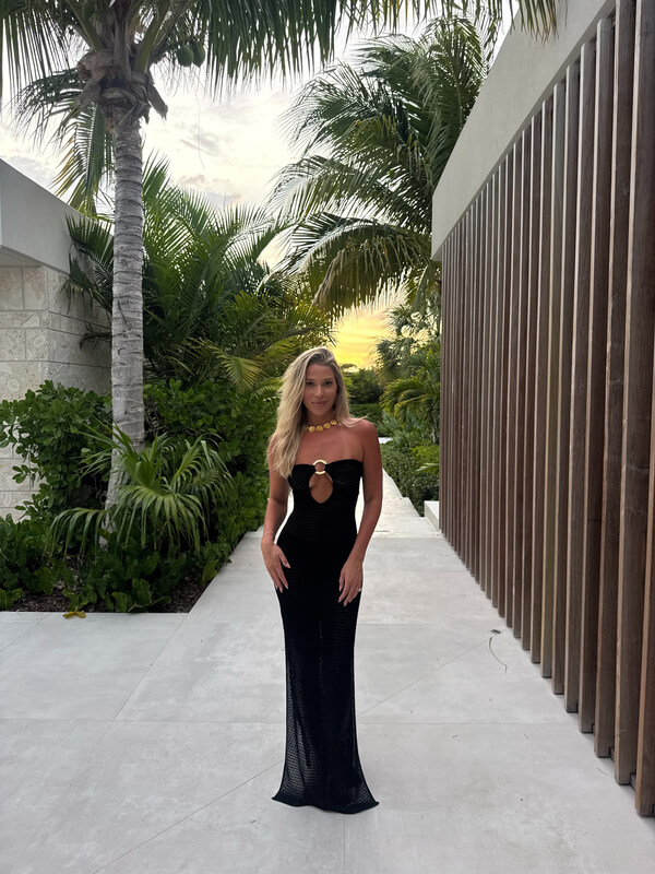 Jordan in a black dress at luxury Turks and Caicos villa rental