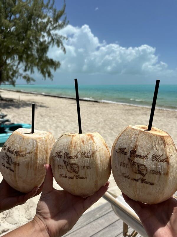 Jordan enjoying her first two days of by the pool with her friend, sipping coconut drinks.
