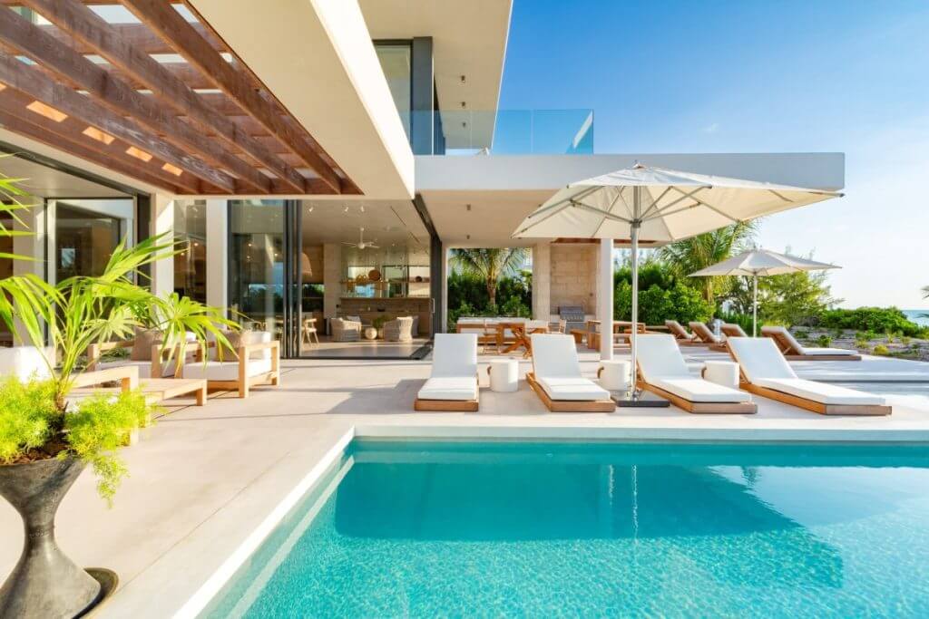 Villa Dune House with sunbeds, umbrellas, pool, and ocean views