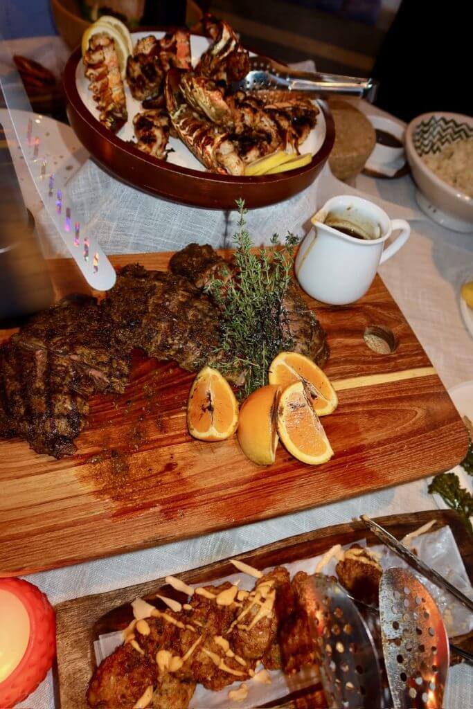 Grilled lobster and steak served by private chef