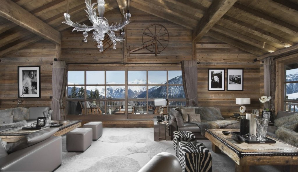 Snow-covered Chalet La Grande Roche Courchevel 1850 with alpine views, part of the New Isle Blue Rewards Program.