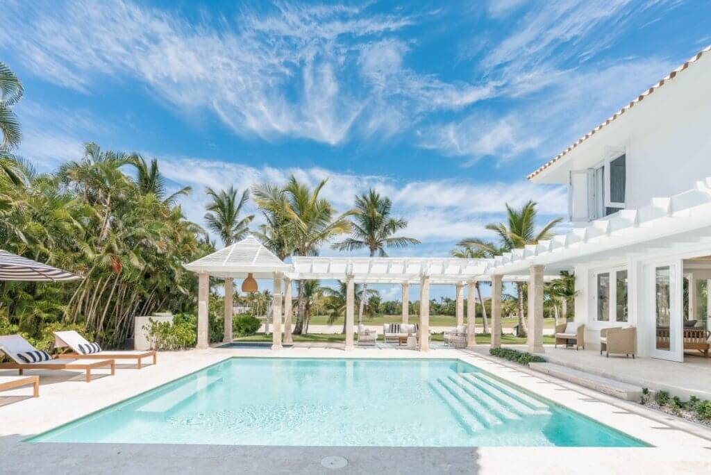 Tortuga Bay B11 villa with private pool, shaded lounge, and palm views