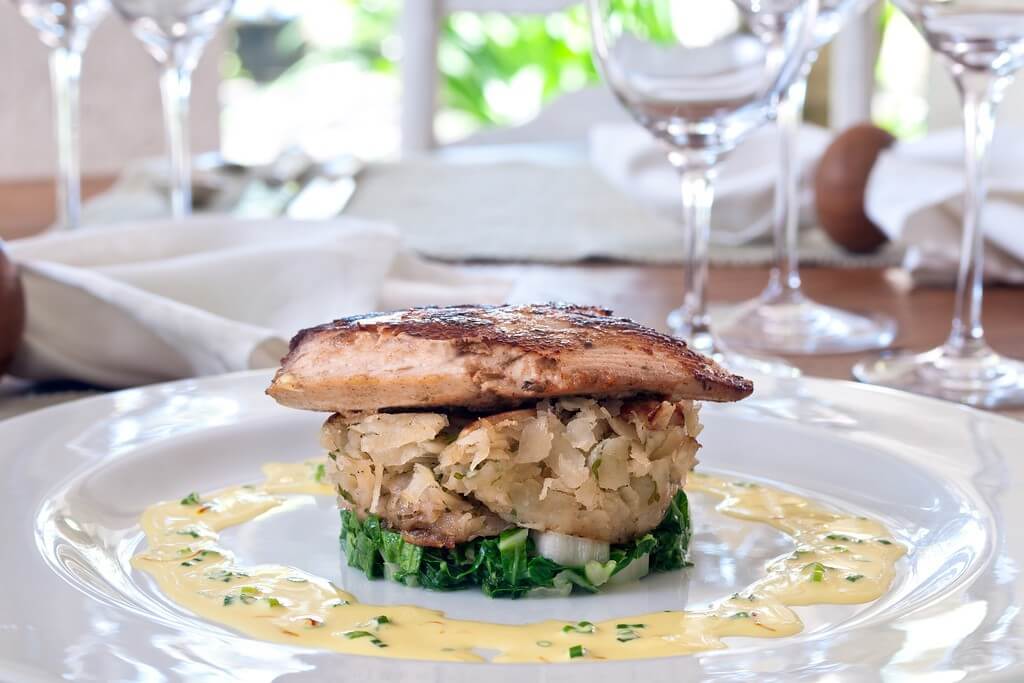Gourmet dining at Fustic House, Barbados for a Luxury Barbados Escape with elegant plating and tropical ambiance