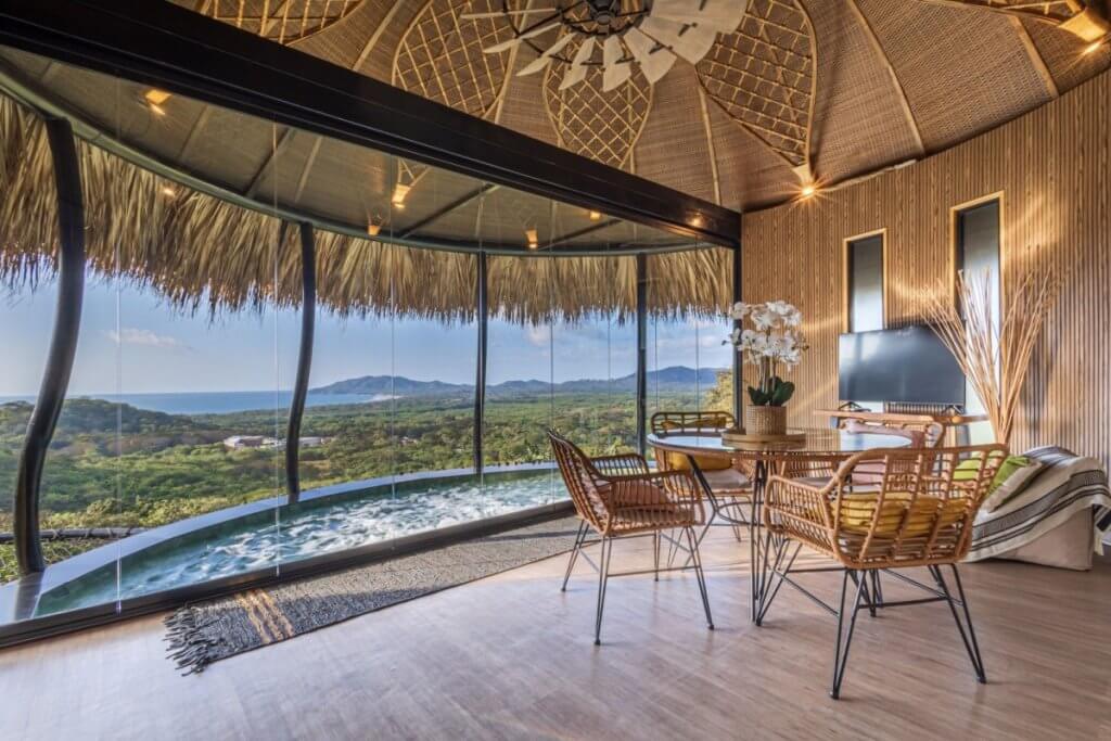 El Nido Costa Rica villa with a curved jacuzzi and jungle–ocean views.