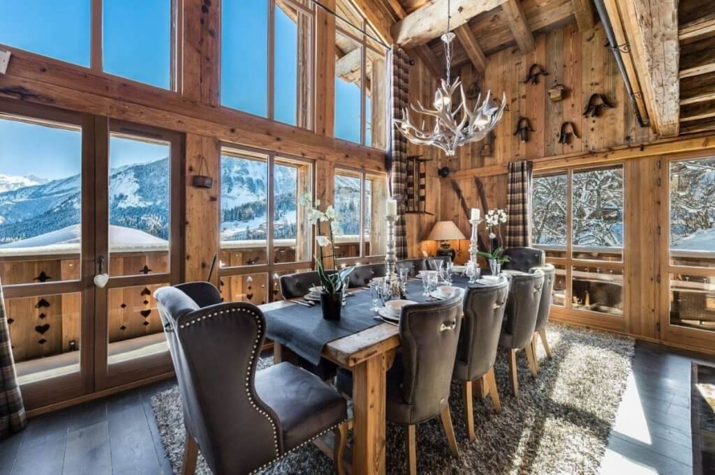 Elegant dining room at Chalet Alpette with panoramic alpine views and refined décor