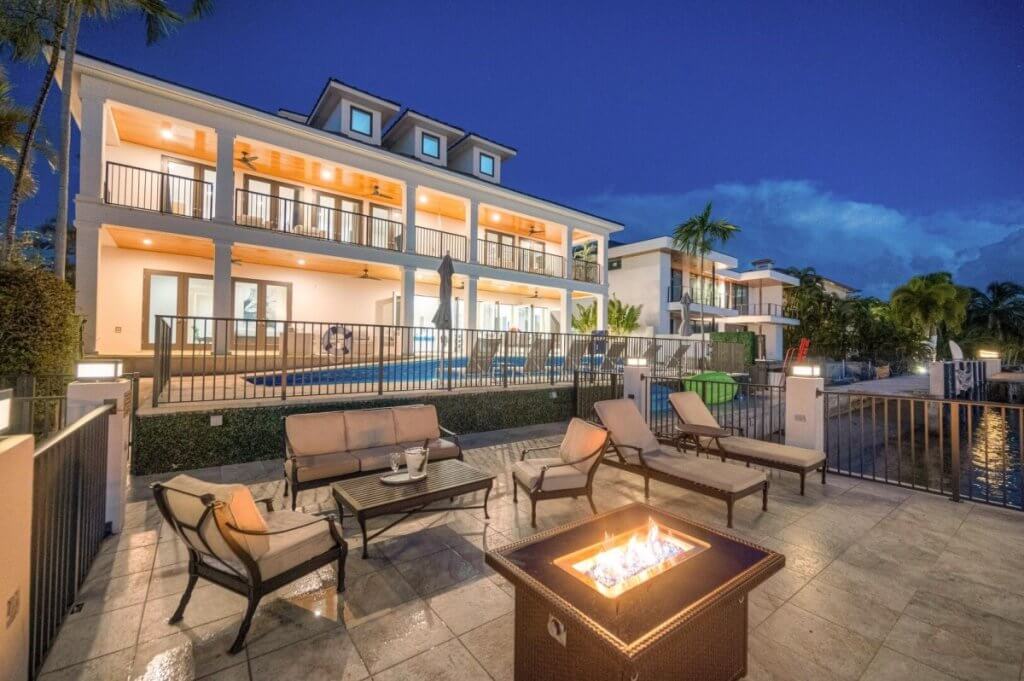 Top 5 luxury destinations in February: Harbour View Key, fire pit lounge, canal access, palm-lined pool, and twilight-lit villa