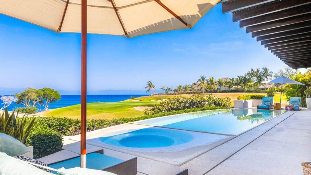 Top 5 destinations in February: Mar Punta Mita, oceanview pool, hot tub, golf greens, palms, and shaded loungers.