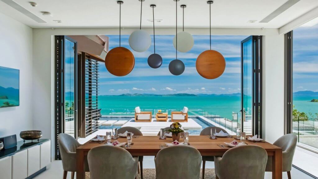Villa Amarapura in Phuket with oceanfront dining room, infinity pool, and panoramic sea view