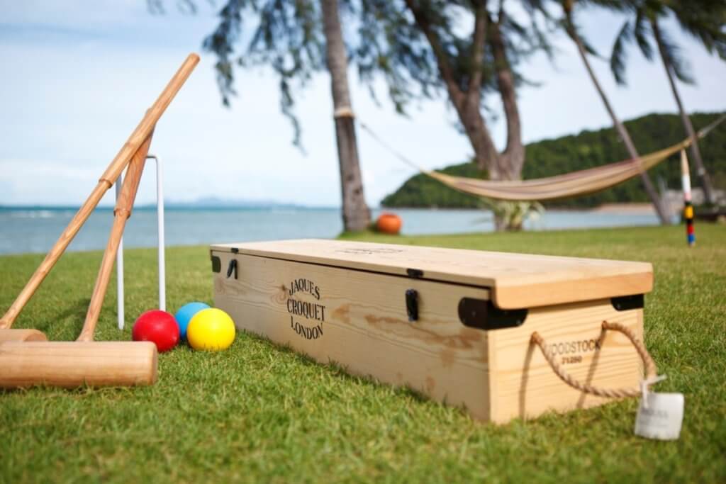 Luxury villa vacation with kids at Baan Kilee Thailand featuring seaside croquet set on manicured lawn