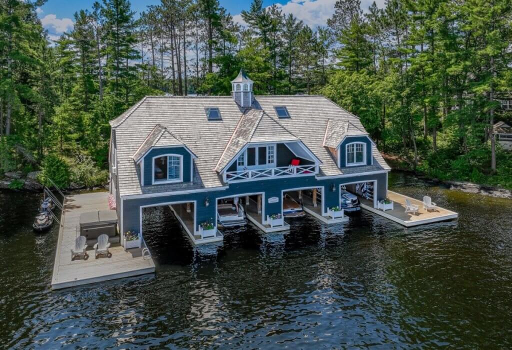 Elegant boathouse at Old Woman Island, a with boat slips and forest-lined lake views.