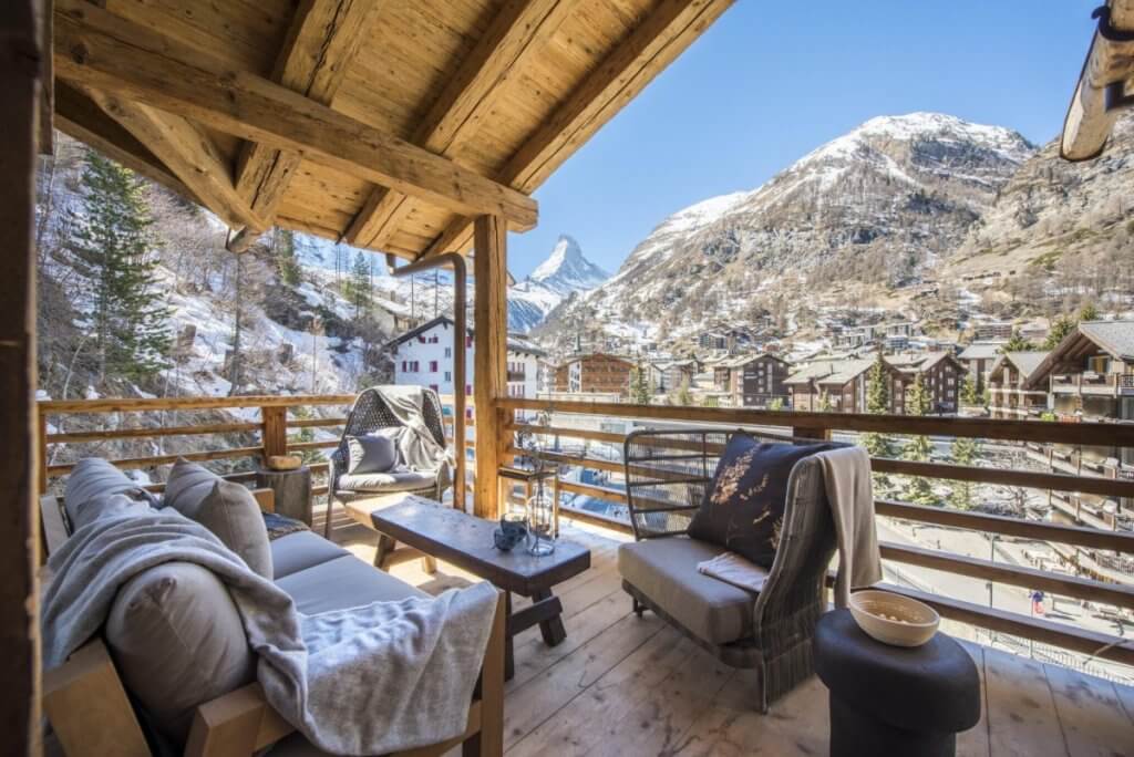 Chalet Denali in Zermatt with mountain-view terrace, cozy seating, and Matterhorn backdrop, a Top 8 Luxury Destination in March