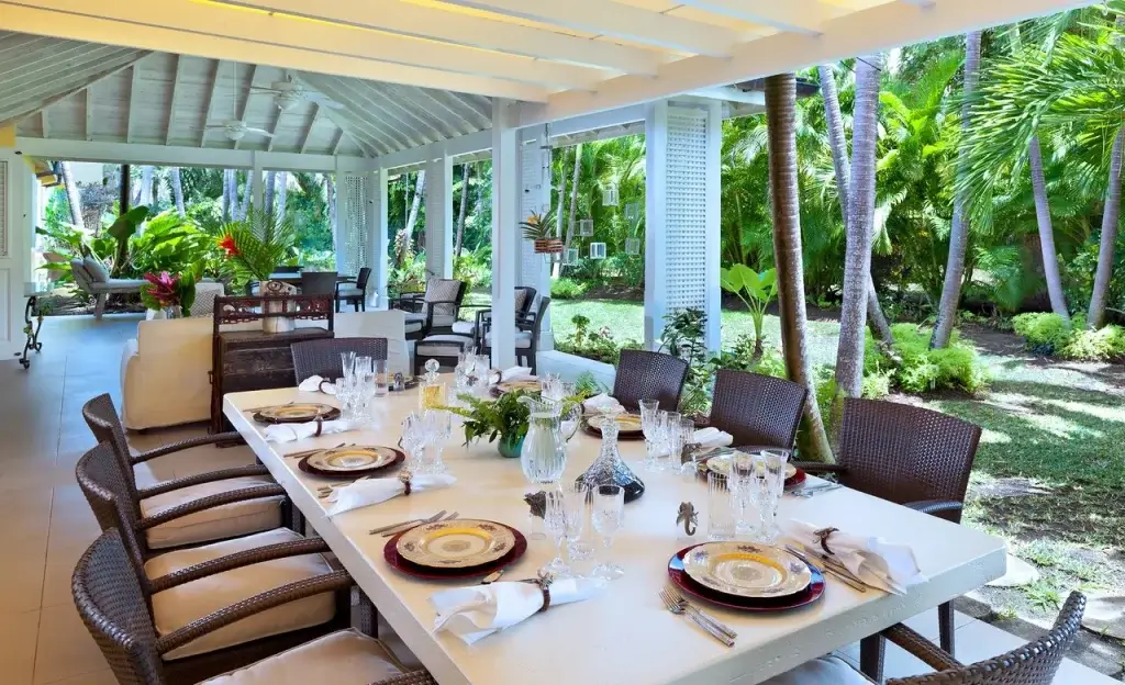 Jamoon, Barbados luxury villas with covered outdoor dining terrace, set table service, and lush tropical garden surroundings