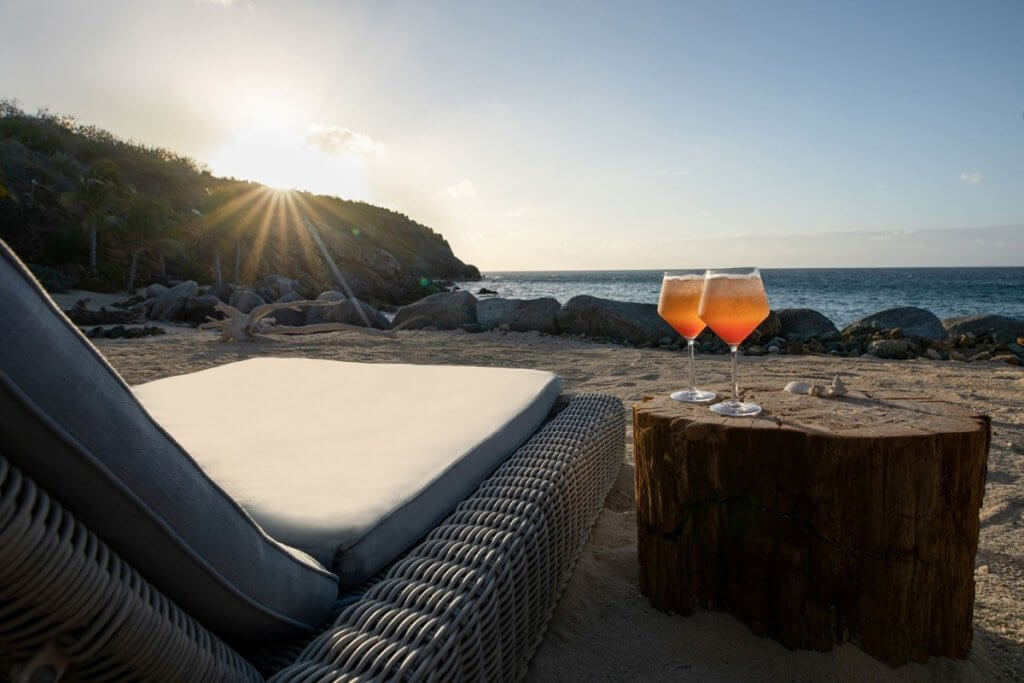 Sunset cocktails on the beach at Branson Estate-Moskito Island, BVIs, showcasing barefoot luxury and coastal elegance.