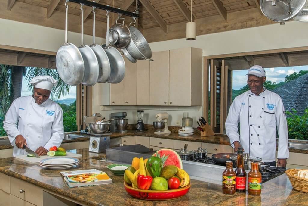 Chefs prepare fresh tropical cuisine in Silent Waters, Jamaica’s gourmet kitchen, where luxury meets culinary artistry.