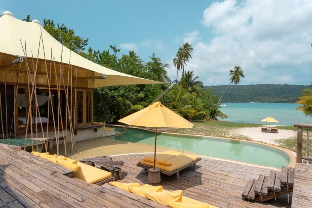 Villa SKiri’s beachfront pool, canopy shade, and lagoon views highlight why it ranks among the best villas for luxury honeymoons.
