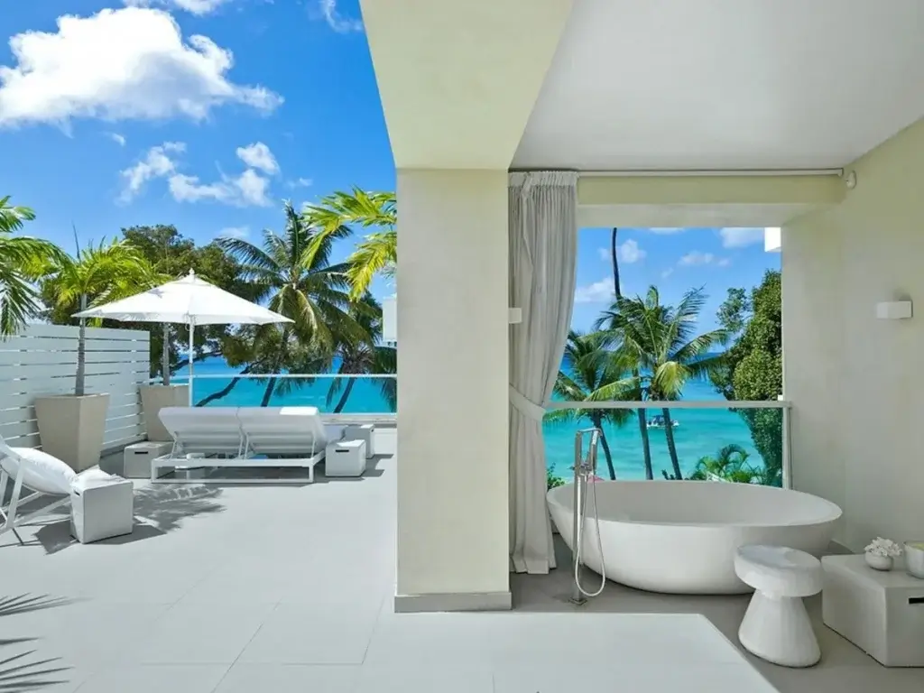 Private terrace at Footprints Estate, Barbados with loungers, ocean views, and spa-style bath reflecting what’s on in Barbados 2026